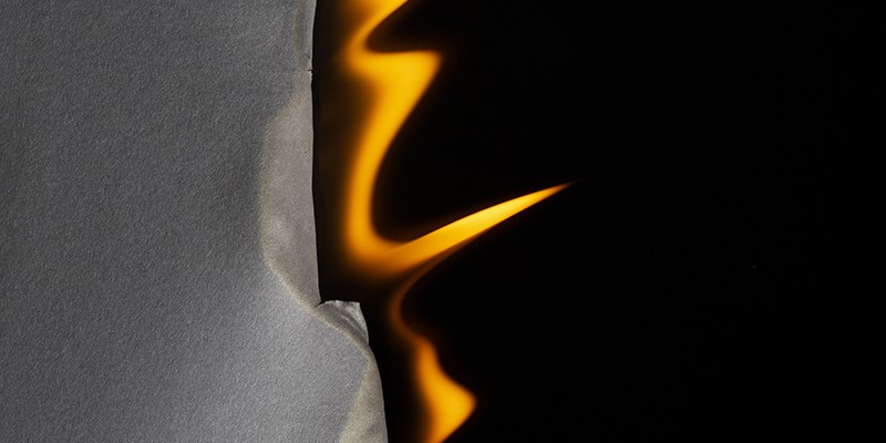 Burning fire retardant fabric